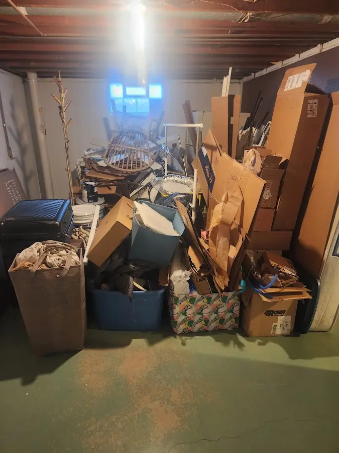 Roll-off dumpster container at job site for 2 Yard Dumpster Rental in Orchard Homes